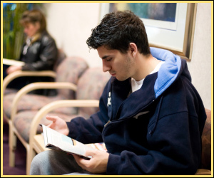 Person reading a leaflet.